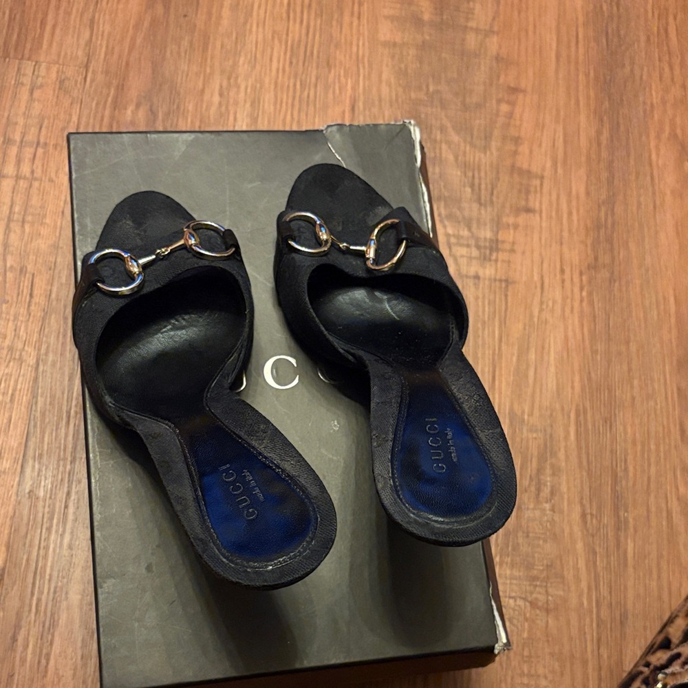 Gucci Black Mules with Gold Accents